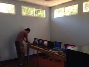 Guillermo working on our donated computers before the newly purchased ones arrive. 